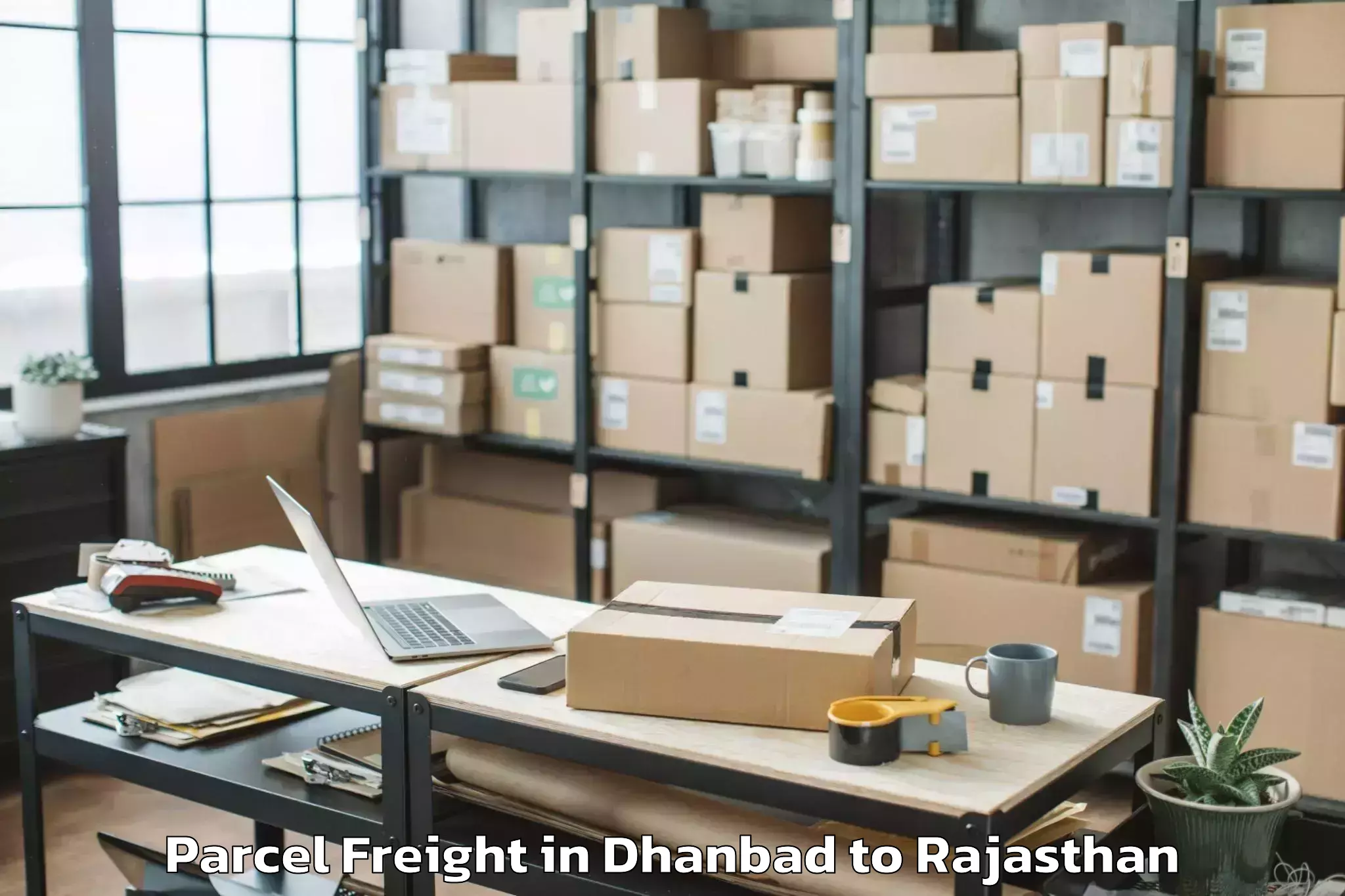 Easy Dhanbad to Madanganj Kishangarh Parcel Freight Booking